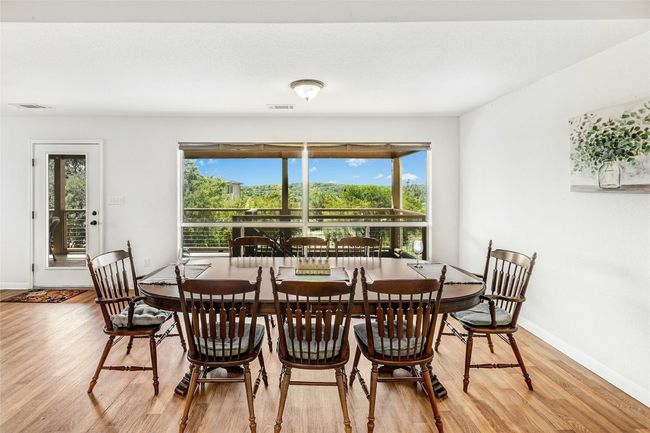 Dining area featuring light wood finished floors and healthy amount of natural light | Image 12