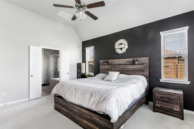 The primary suite has high ceiling, natural light, and a private bathroom. | Image 19