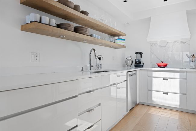 Kitchen with dishwasher, white cabinetry, and light countertops | Image 4