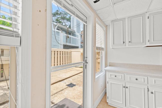 Entryway with plenty of natural light, a paneled ceiling, and light tile patterned floors | Image 18