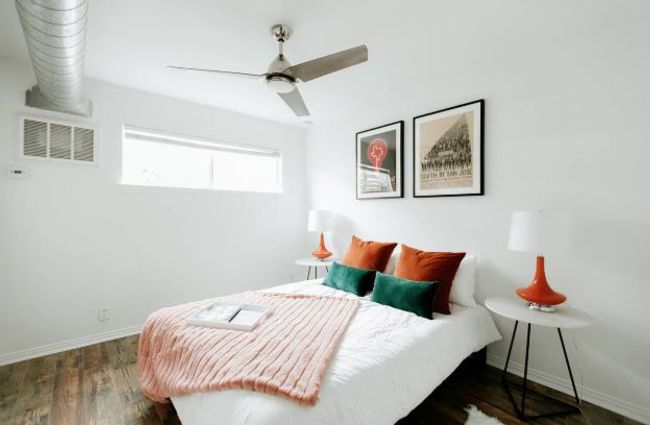 Bedroom with wood finished floors and ceiling fan | Image 14