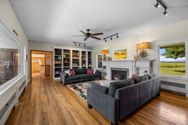 Large living room with whole wall of built in bookshelves | Image 9