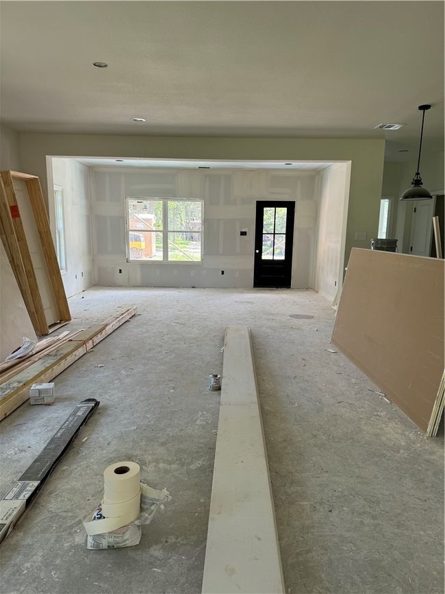 Unfurnished living room featuring healthy amount of natural light | Image 6