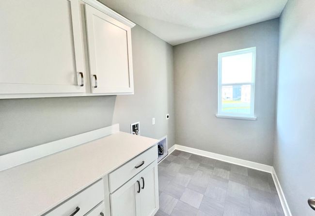 Actual home: Laundry is conveniently located on the upper level next to the home's four bedrooms. | Image 36