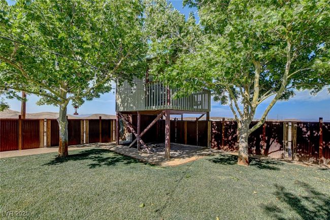 View of fenced backyard | Image 43