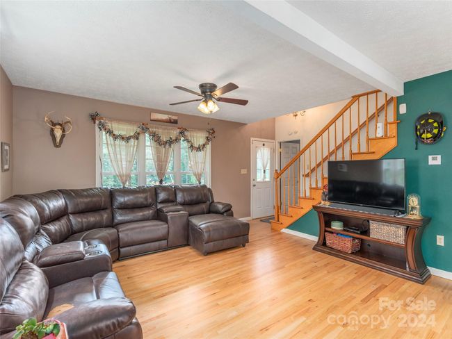 Large open family room with refinished hardwoods | Image 4
