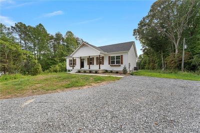 View of front of house with a porch and central AC unit | Image 3