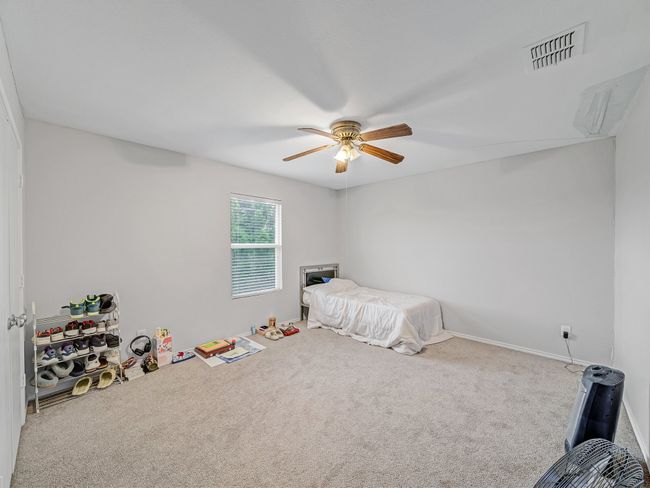 Unfurnished bedroom featuring carpet and ceiling fan | Image 24