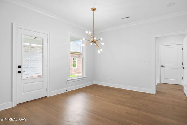 Door In Breakfast Area Leads To Covered Porch | Image 18