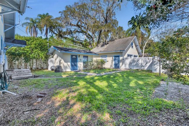 View of detached apartment and two car garage | Image 19