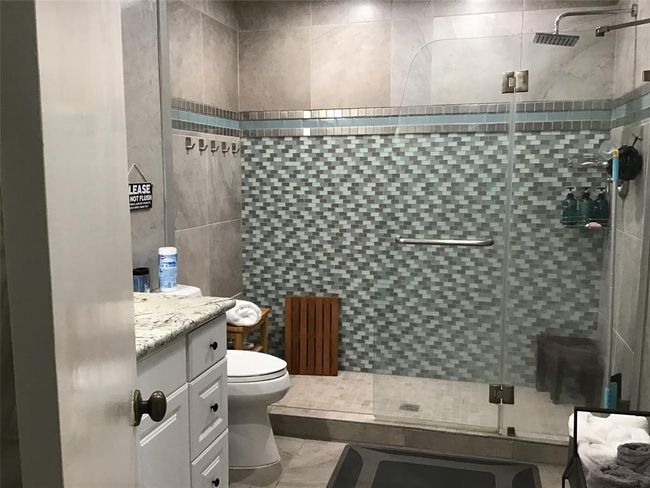 Primary or secondary bath. Offers large walk-in shower and single sink vanity | Image 27