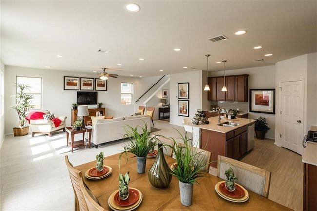 Dining area featuring recessed lighting, a ceiling fan, and stairway | Image 7