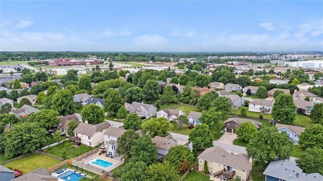Aerial perspective of suburban area featuring a pool area | Image 45