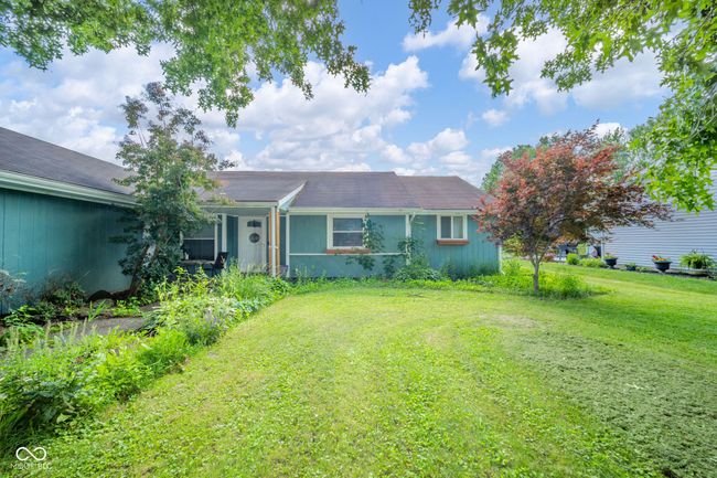 ranch-style house with a front yard | Image 6