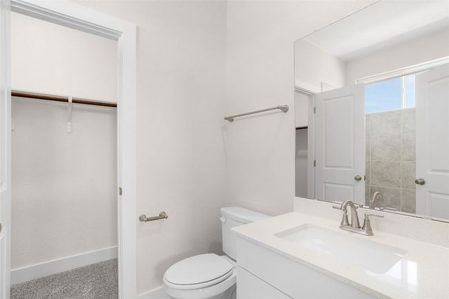 Bathroom featuring toilet and vanity | Image 22