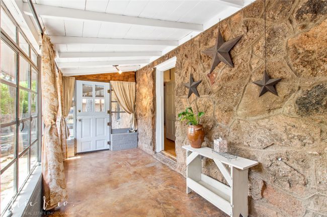 All season sun porch with beam ceiling added in the 50's is a delightful addition to the history of the home. | Image 5