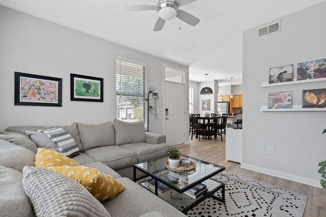 Living room featuring a ceiling fan and light wood finished floors | Image 7