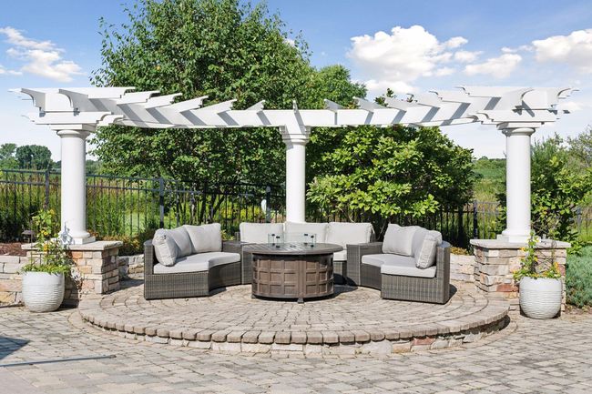 The yard is surround by beautiful landscaping and well thought out places to relax and take in the beauty. | Image 81