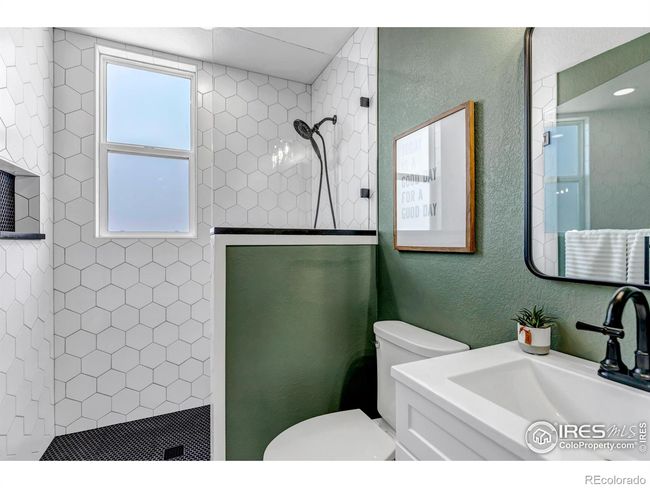 Full bathroom with walk in shower located on main floor creates the perfect guest suite! | Image 18