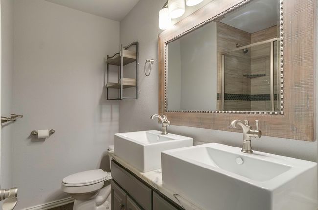 Bathroom with a shower stall and double vanity | Image 30