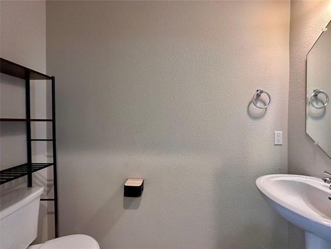 Bathroom with toilet and a sink | Image 20
