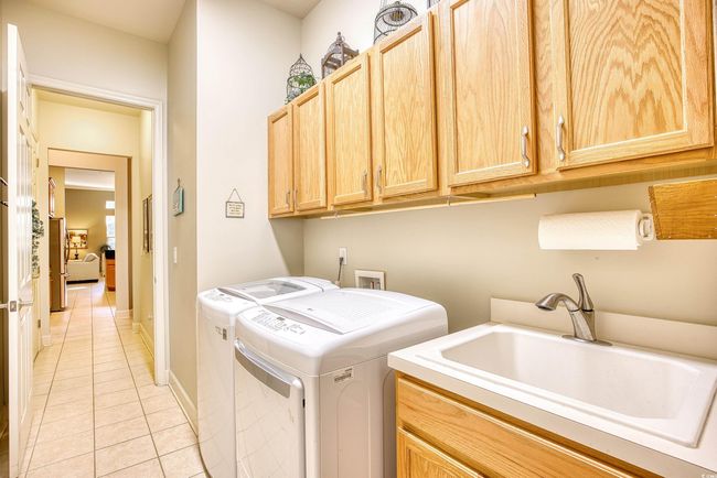 Washer and dryer work, and in this area is a large walk-in broom closet. | Image 24