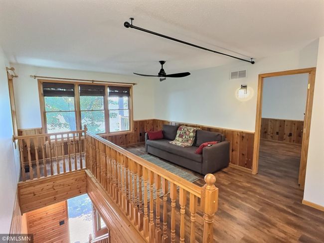 Another view of the den, the primary bedroom is to the left. The 2nd bedroom and bathroom is down the hall. | Image 17