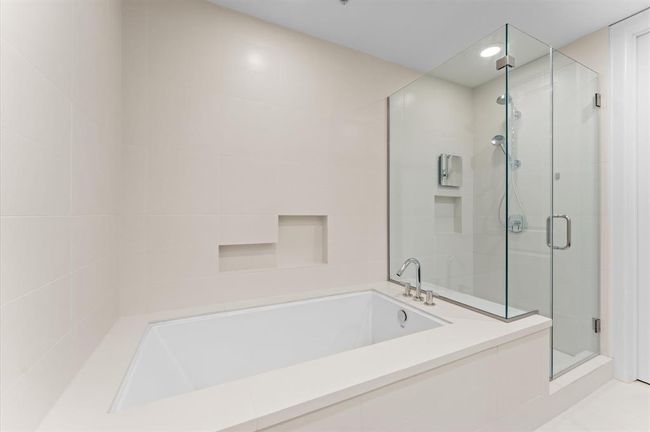 Separated shower and jetted tub. | Image 15