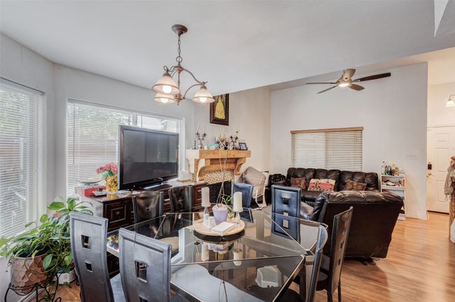 Dining room featuring ceiling fan and light wood-type flooring | Image 14
