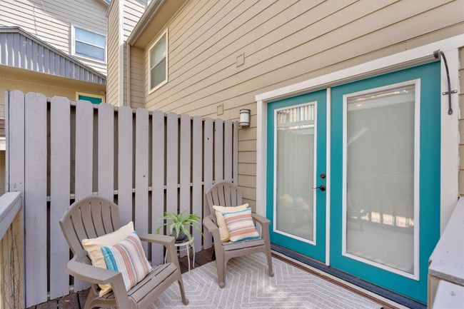 The private deck offers a tranquil outdoor space where you can relax and enjoy the fresh air. | Image 4