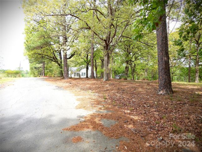 Streetview in front of the home. Property includes an area across the street. | Image 23