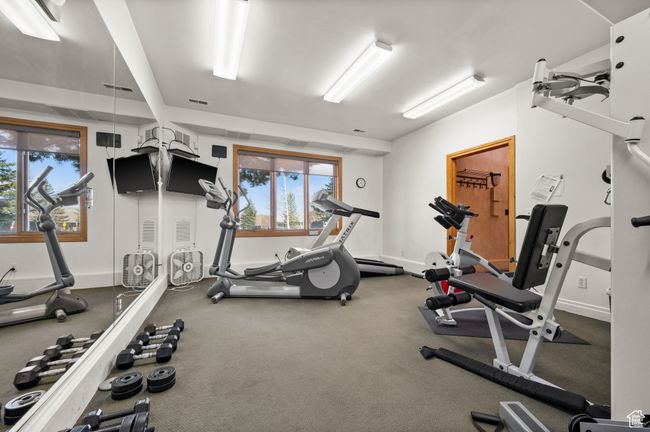 Clubhouse: Community Exercise room featuring baseboards, a healthy amount of sunlight, and visible vents | Image 36