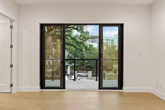 Living room with sliding doors leading to balcony | Image 14