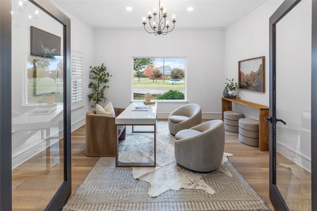Office area with wood finished floors, a chandelier, crown molding, and recessed lighting | Image 25