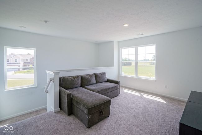carpeted living room featuring baseboards | Image 18