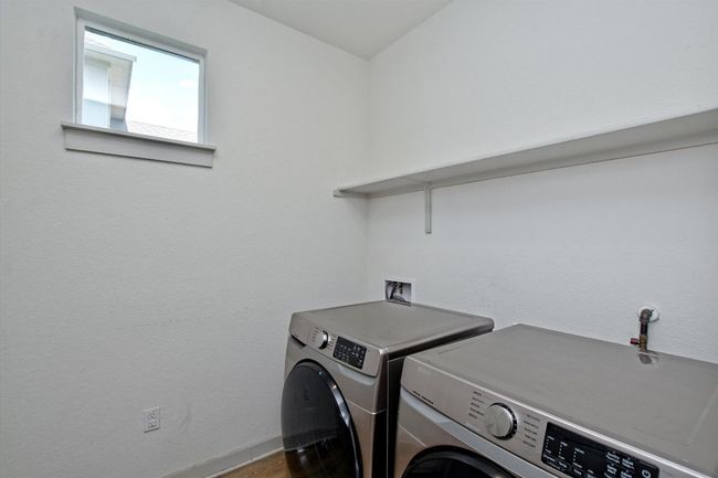 Washer and dryer in utility room. | Image 29