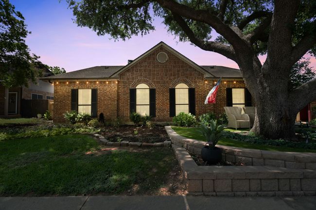 Ranch-style house featuring brick siding and a shingled roof | Image 4