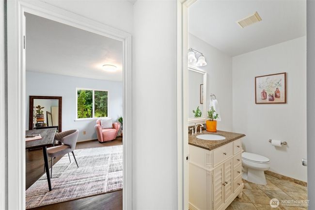 A bathroom just off the main floor bedroom. | Image 14