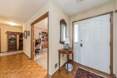 Foyer has beautiful parquet flooring and a generou | Image 2