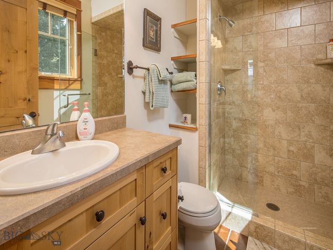 Ensuite bath for bedroom #1 with tiled shower | Image 42