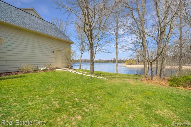 Garage side of property (east) w/ side entry door | Image 68
