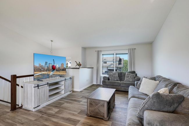 Bright open living room offers the perfect space to relax and unwind, with plently of natural light and a welcoming atmosphere ideal for everyday living or entertaining guests. | Image 7