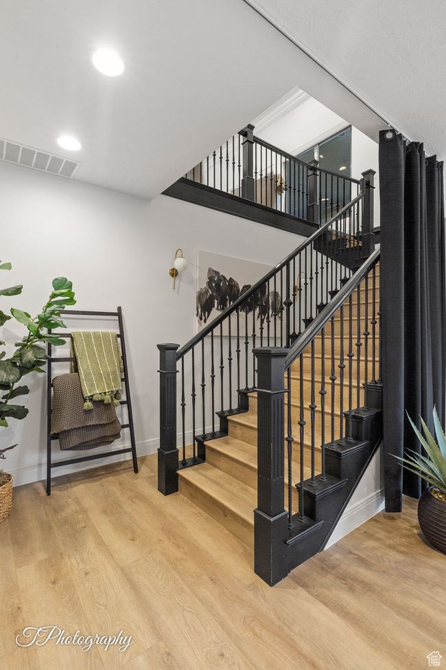 Stairs featuring wood finished floors, baseboards, and recessed lighting | Image 39