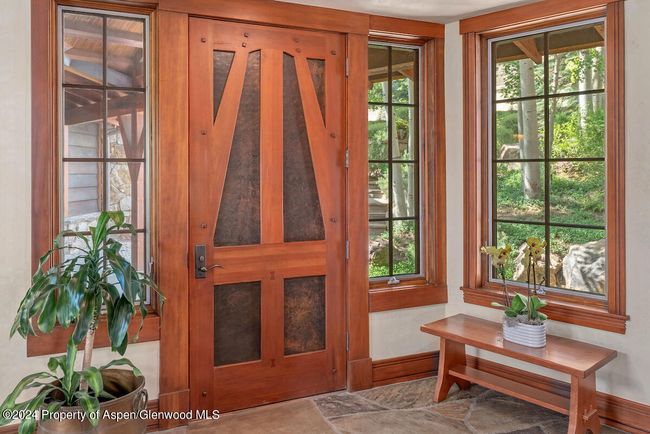 An elevator in the foyer connects to all levels in the home. | Image 6