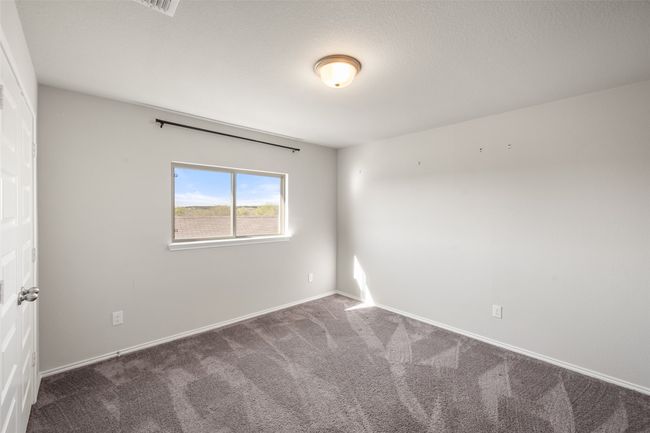Unfurnished room featuring baseboards and carpet flooring | Image 12