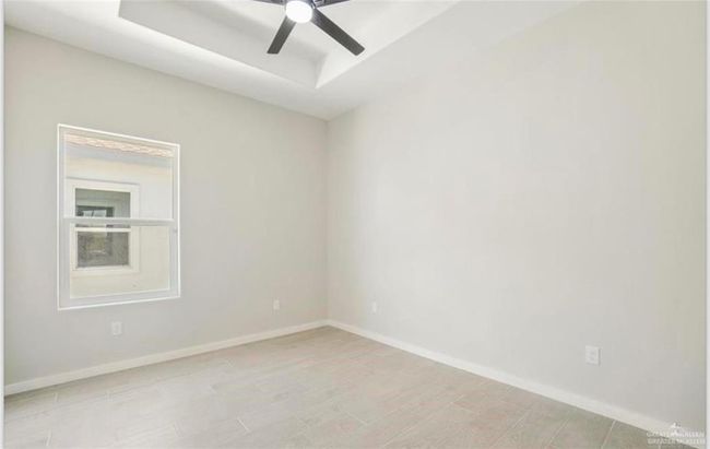 Unfurnished room with light hardwood / wood-style floors and ceiling fan | Image 6