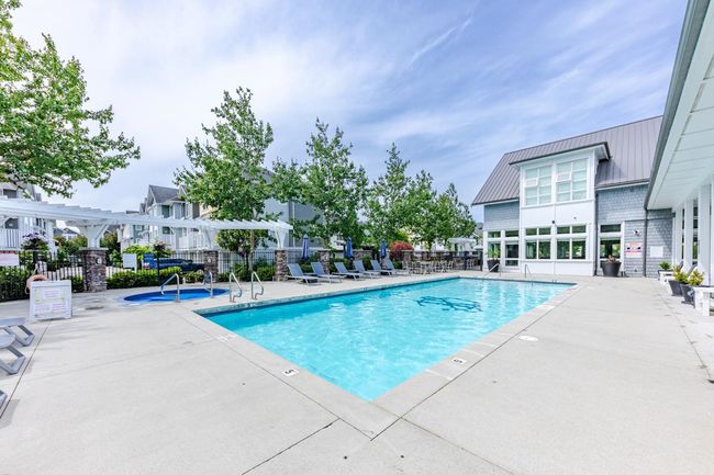 Community pool with a patio area | Image 40