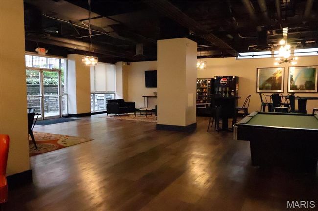 Game room featuring wood finished floors and billiards table | Image 22