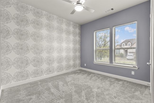 Carpeted empty room featuring baseboards and ceiling fan | Image 24