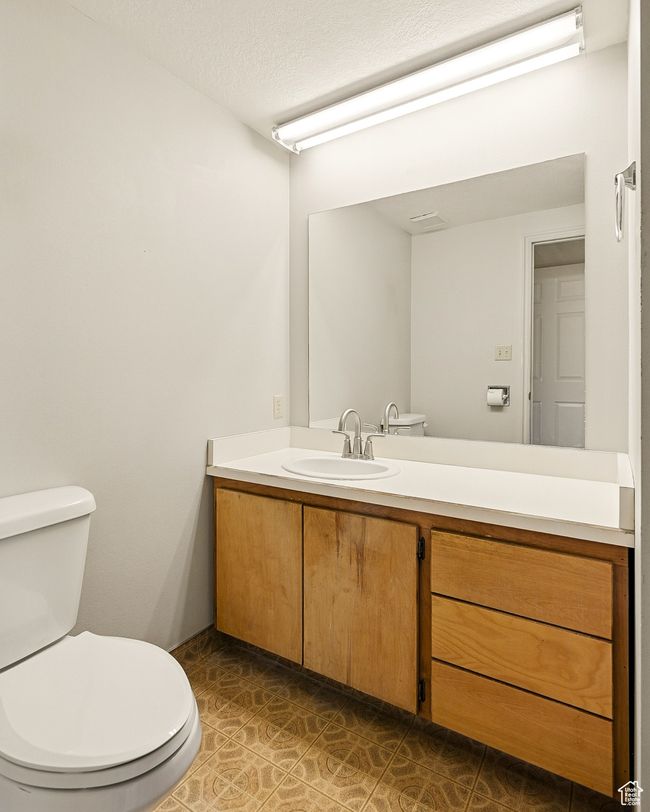 Bathroom with toilet and vanity | Image 21